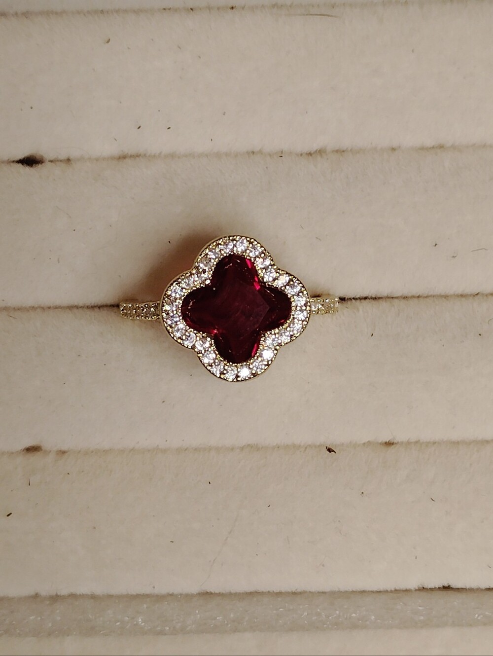 Gold Ring with Deep Red Clover-Cut Center and Pavé Halo
